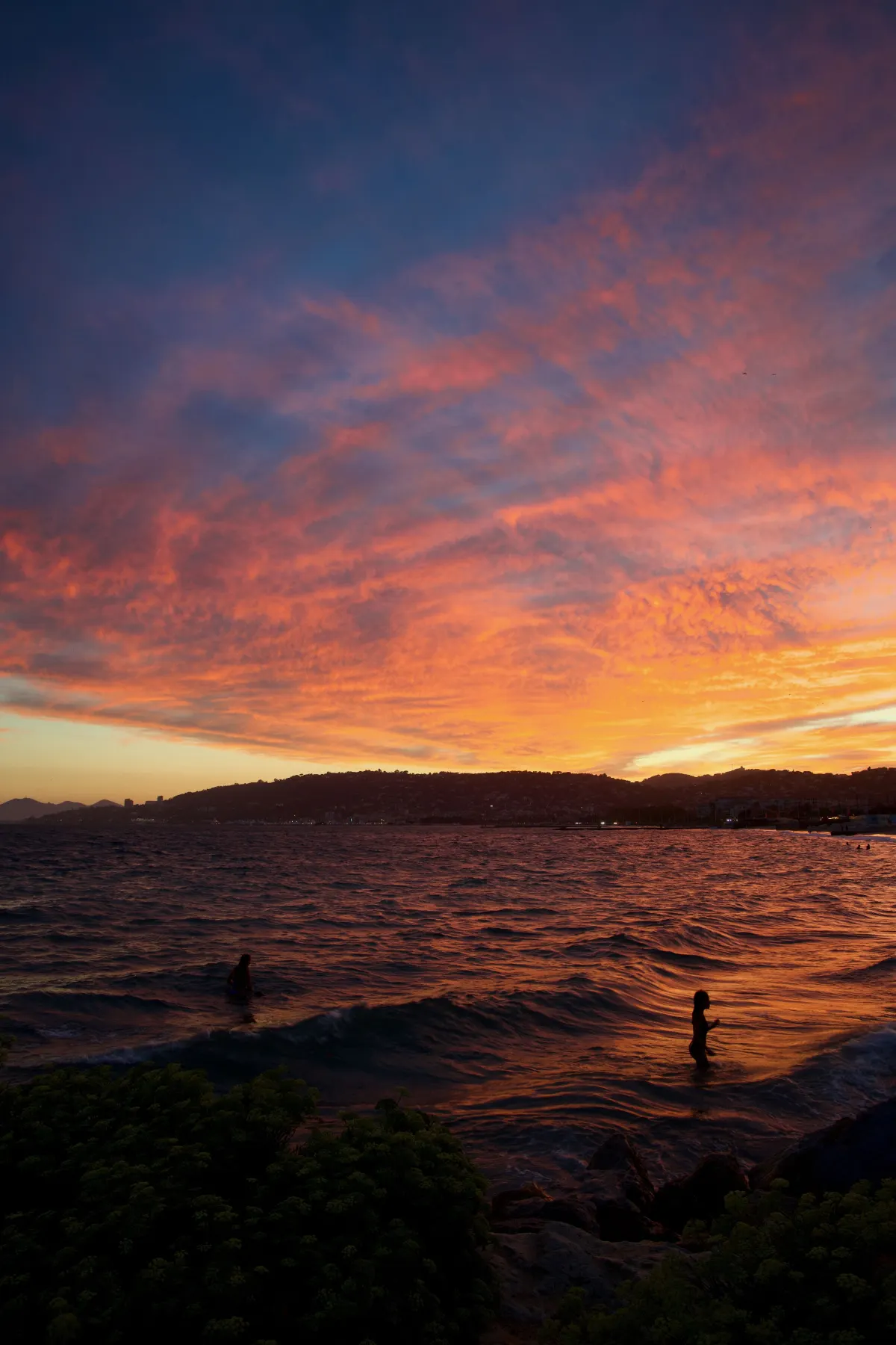 Vertical view of the fire sky spreading above the beach and sea at Juan-les-Pins