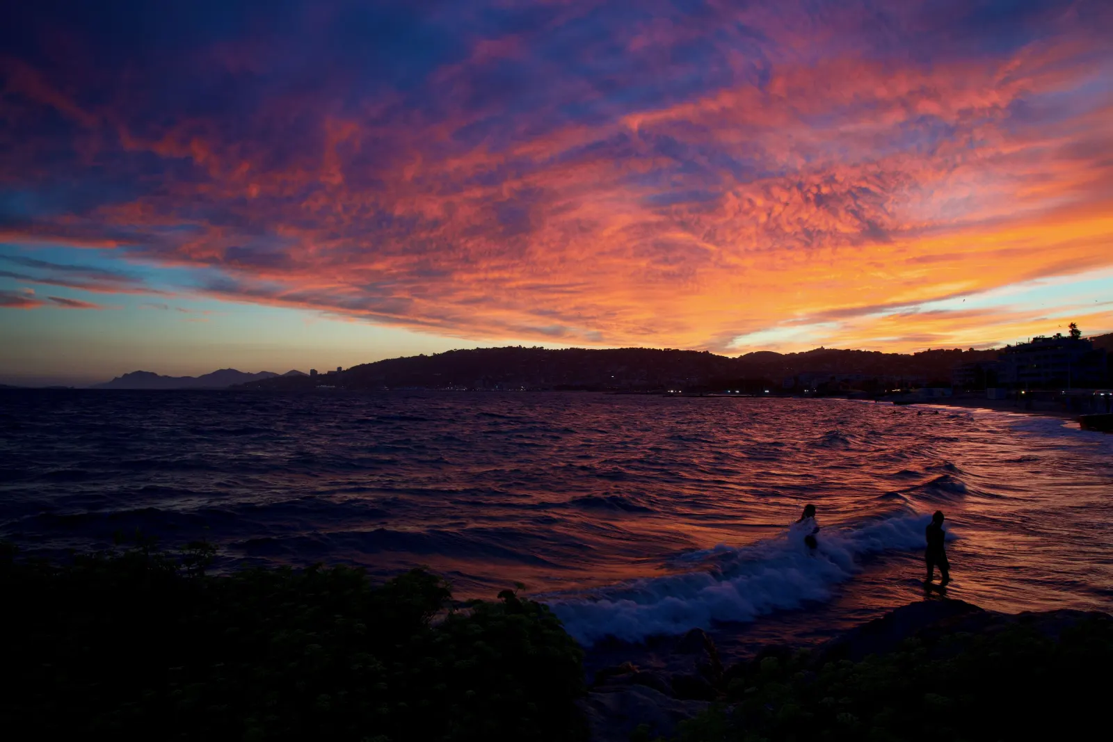 Fiery red and orange sunset over the sea at Juan-les-Pins