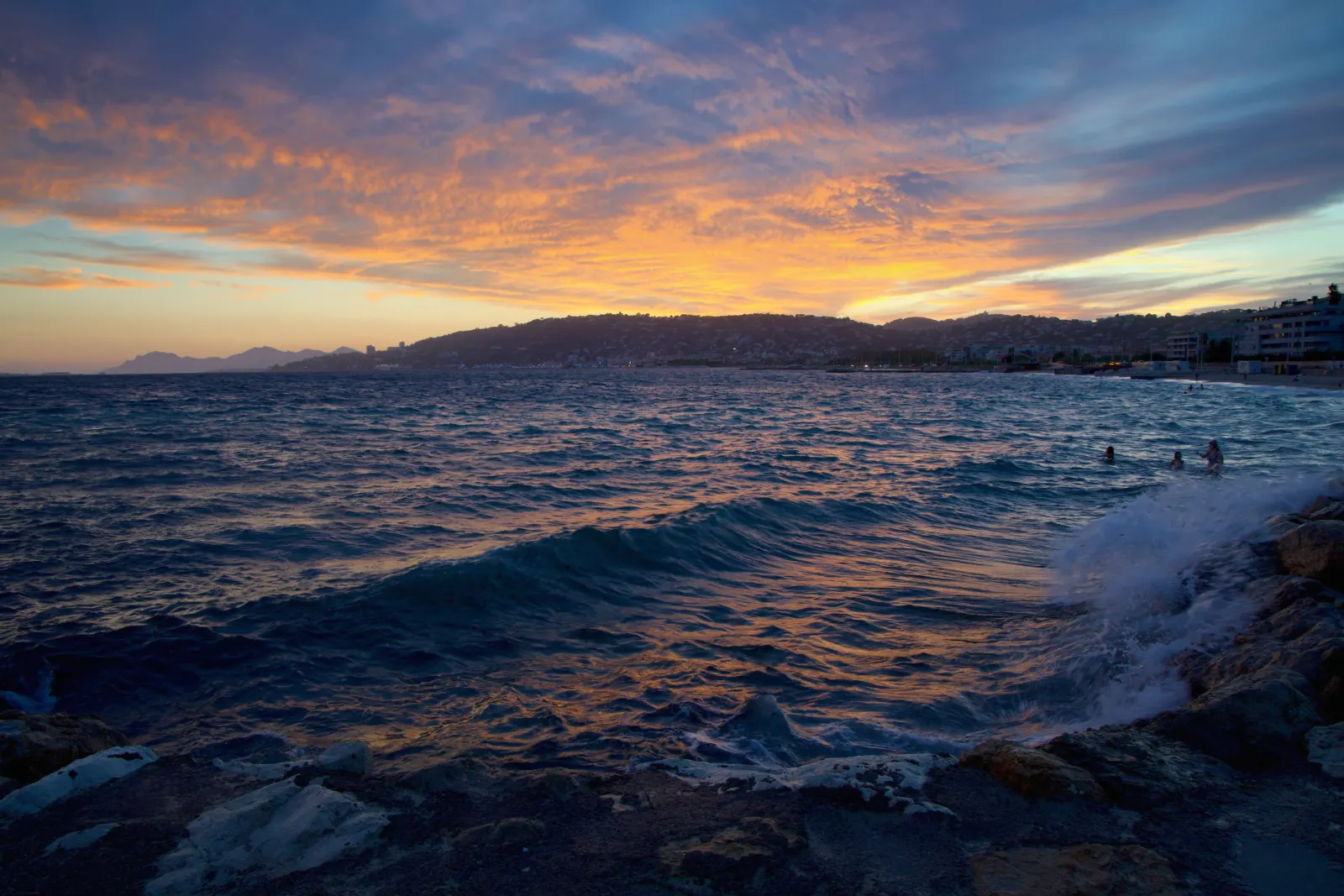 Golden-hour light over the sea and coastline at Juan-les-Pins