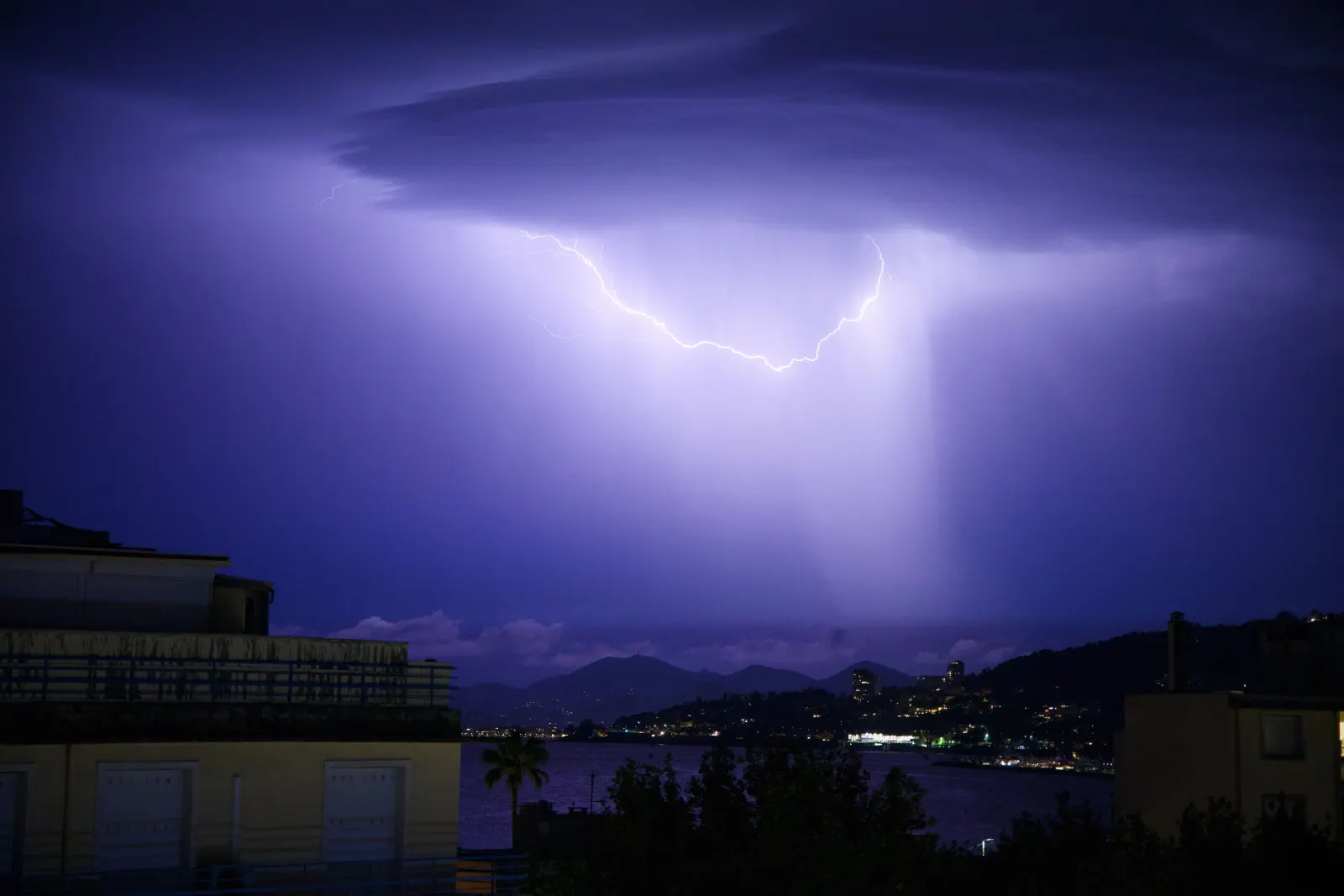 Lightning illuminating the city of Juan-les-Pins at night