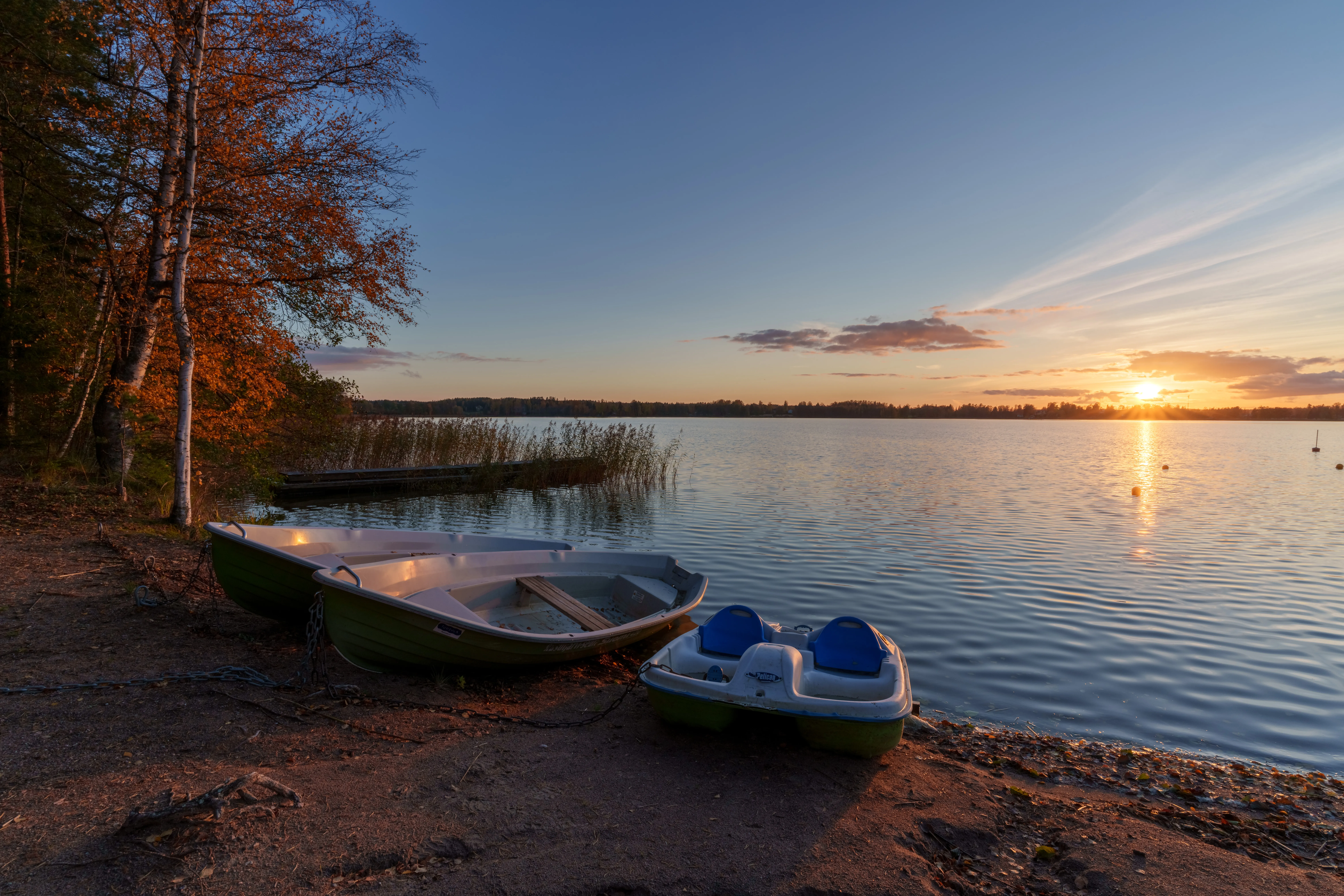 Sunset over a lake with dramatic sky